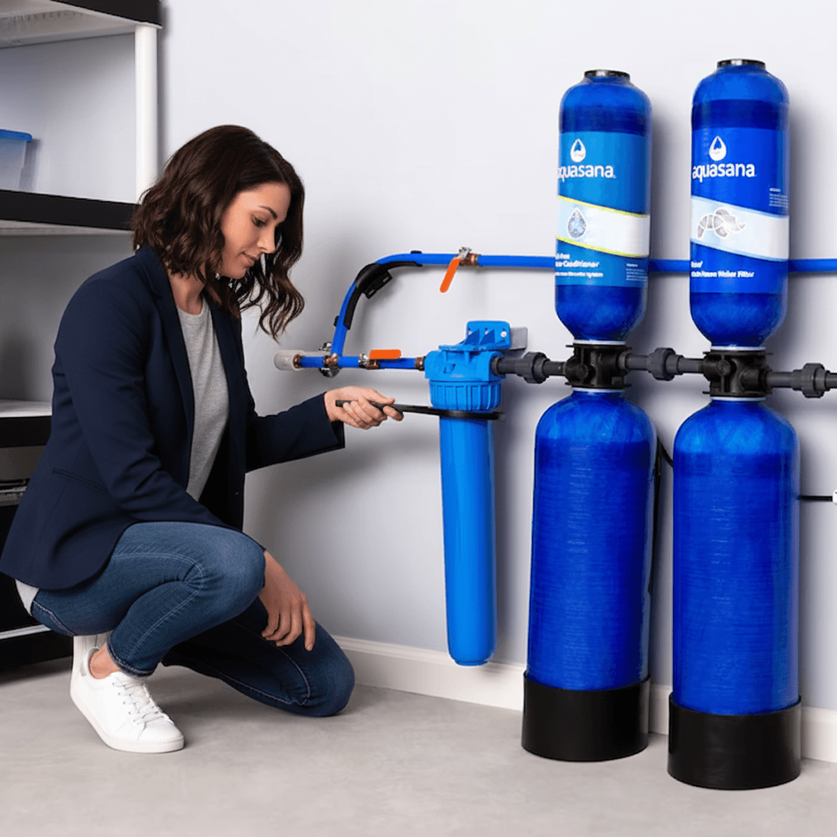 Whole-home water filtration tanks installed along a wall